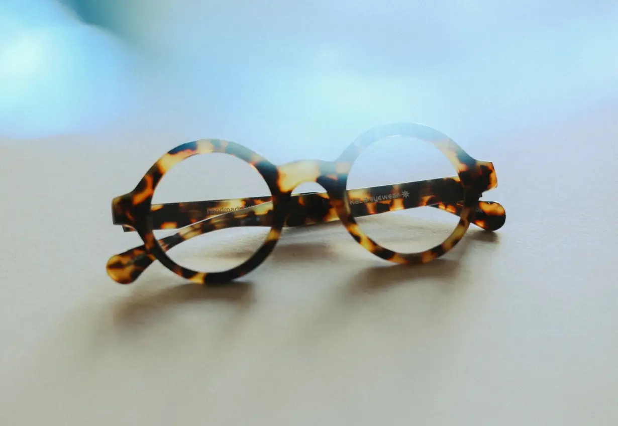 pair of glasses sitting on a surface